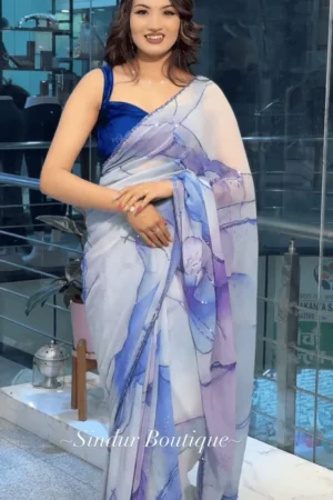 White and Lavender Shaded Organza Saree With Abstract Watercolor Print and Subtle Sequin Detailing Paired with Rich Royal Blue Velvet Blouse