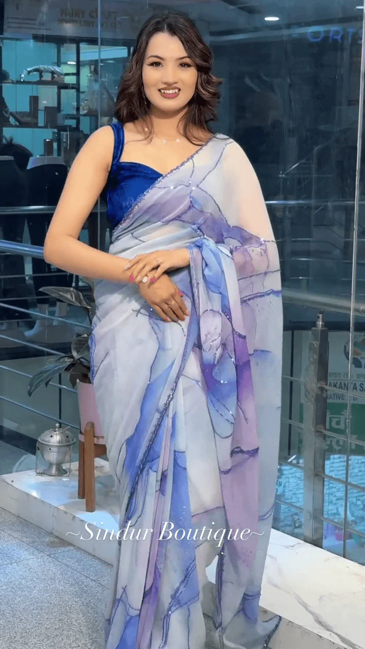 White and Lavender Shaded Organza Saree With Abstract Watercolor Print and Subtle Sequin Detailing Paired with Rich Royal Blue Velvet Blouse